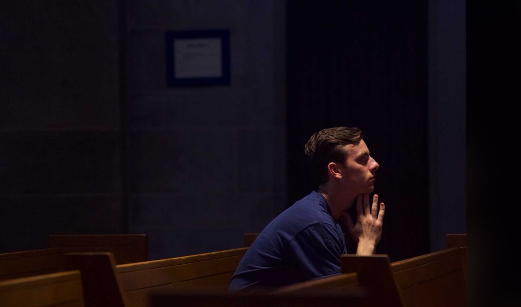 A parishioner prays during Mass at the Cathedral of Mary Our Queen in North Baltimore on May 7, 2025.