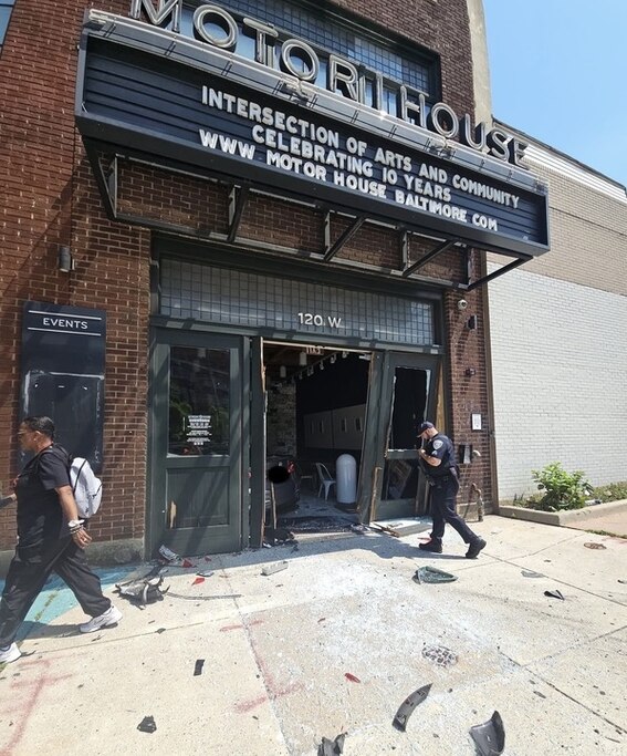 Police respond to the damage at Motor House following the car crash on June 29.