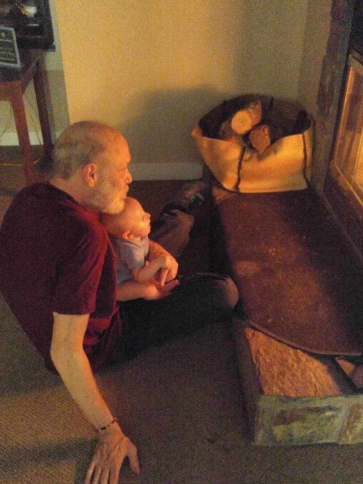 Matthew Schmale holds his grandchild, Wilder, during a family vacation in Massanutten, Va.