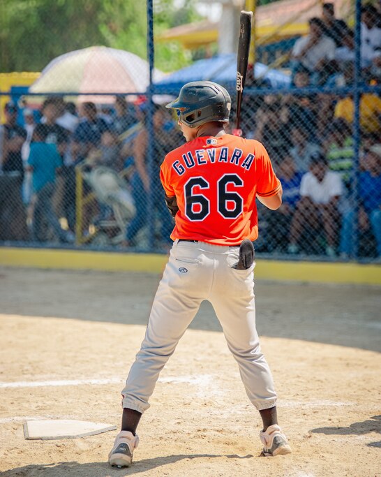 Every year in Cojedes state in Mexico, an event is held with the most well-known baseball players called the “Prospects v. Signed.” All of the signed players wear their corresponding teams jerseys. Luis Guevara wears his orange Orioles jersey on December 30, 2024.