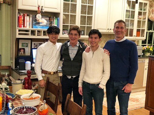 Jeremy Walston and George Lavdas with their sons Alexander and Oliver when they're older.