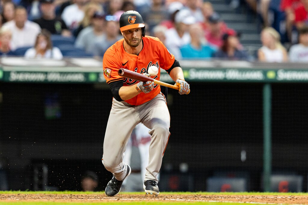 CLEVELAND, OHIO - AUGUST 3: Austin Slater #15 of the Baltimore Orioles bunts for a single in the fifth inning of the game against the Cleveland Guardians at Progressive Field on August 3, 2024 in Cleveland, Ohio. (Photo by Lauren Leigh Bacho/Getty Images)