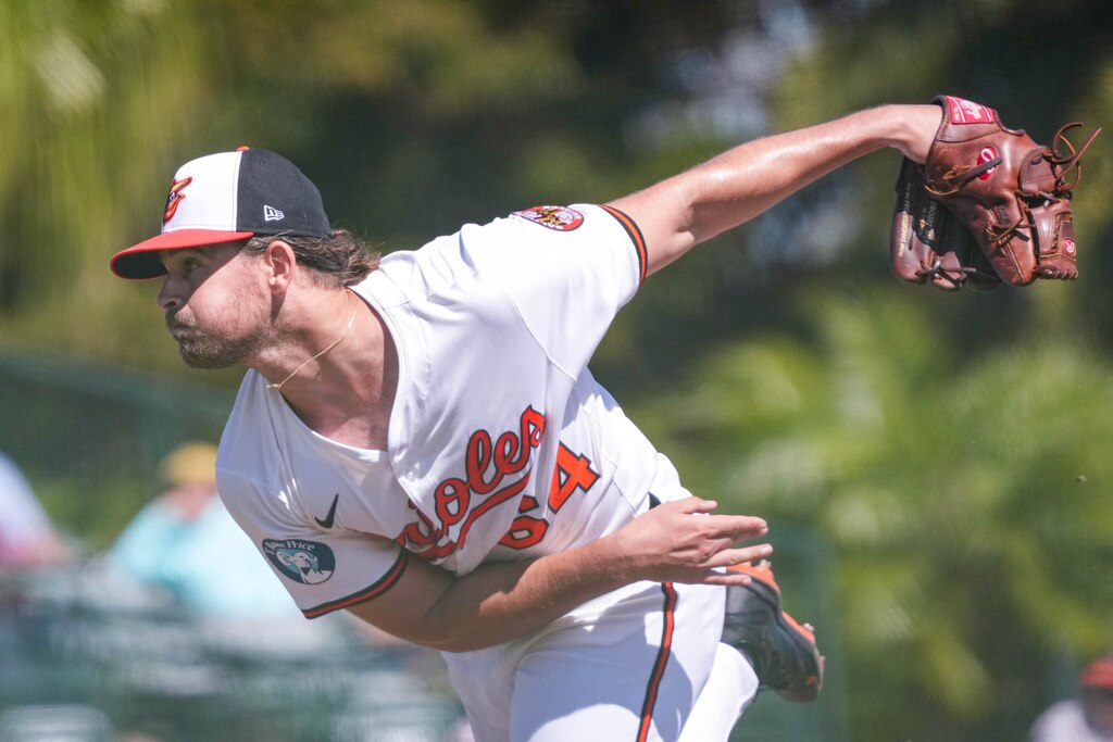 Baltimore Orioles pitcher Dean Kremer (64) delivers a pitch during a Grapefruit League game against the Detroit Tigers at Ed Smith Stadium in Sarasota, Fla. on Tuesday, Feb. 25, 2025.