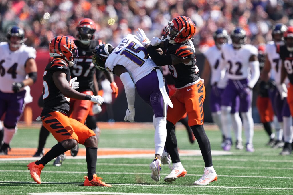 CINCINNATI, OHIO - OCTOBER 06: Nelson Agholor #15 of the Baltimore Ravens fails to make a catch as Cam Taylor-Britt #29 and Jalen Davis #35 of the Cincinnati Bengals defend during the second quarter at Paycor Stadium on October 06, 2024 in Cincinnati, Ohio. (Photo by Dylan Buell/Getty Images)