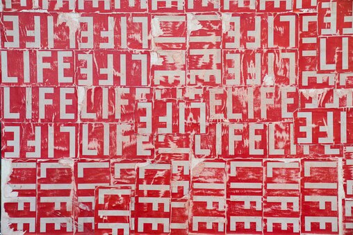 Waymond Harrison uses the LIFE Magazine logo as his artist signature. He plans to use this canvas in particular to create a painting of Muhammad Ali. June 17, 2025.