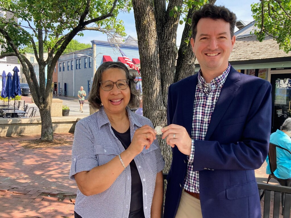 Rhonda Pindell Charles and Jared Littmann, Democratic candidates for mayor in Annapolis, agreed to a coin toss to settle who goes first in a forum Tuesday.