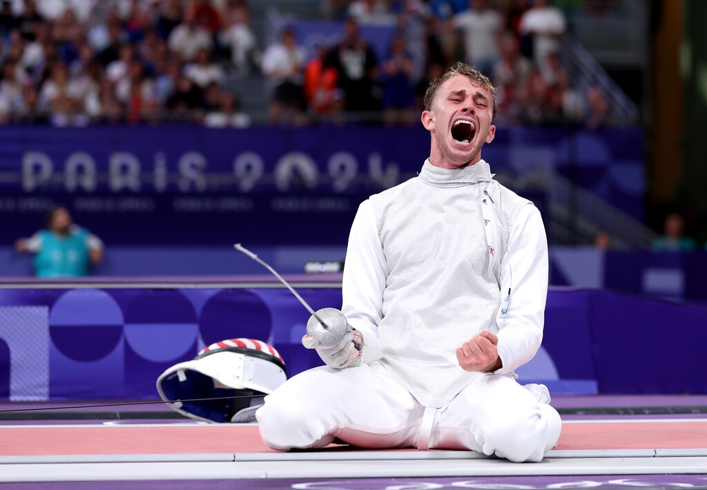 PARIS, FRANCE - JULY 29: Nick Itkin of Team United States celebrates victory in the Men’s Foil Individual Table of 8 match between Guillaume Bianchi of Team Italy and Nick Itkin of Team United States on day three of the Olympic Games Paris 2024 at Grand Palais on July 29, 2024 in Paris, France. (Photo by Carl Recine/Getty Images)