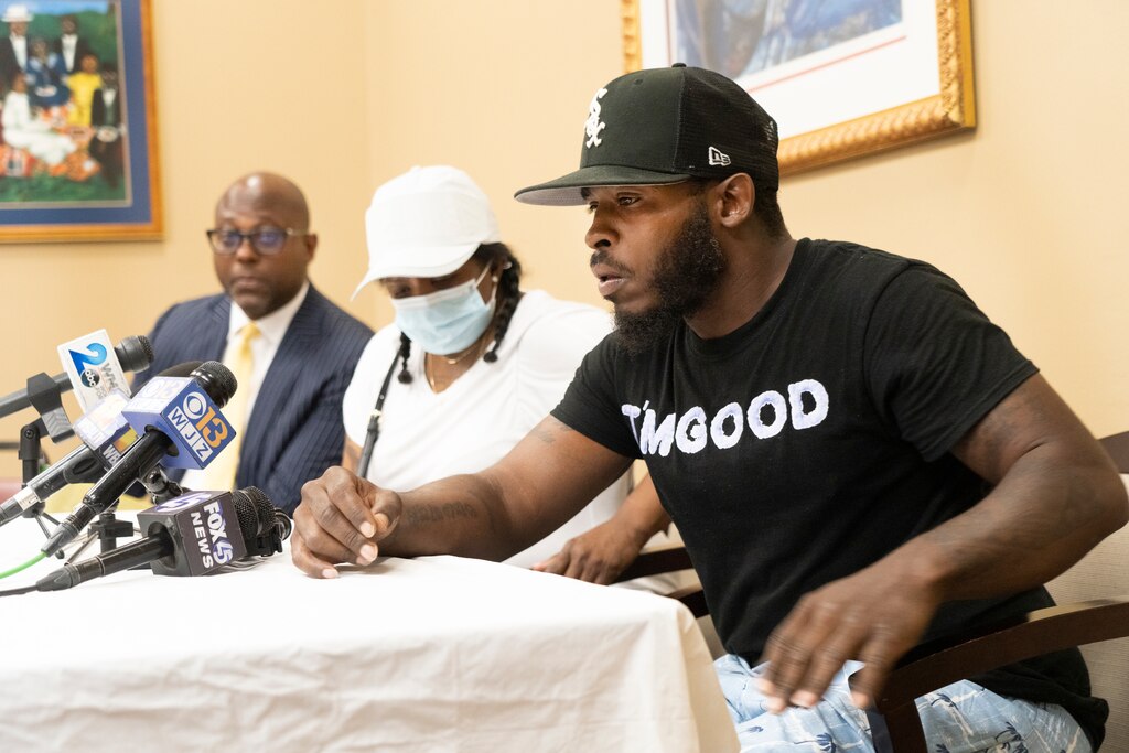 "He's my Son" say a very choked up Tavon Scott Sr. (right) with attorney J. Wyndal gordon (left) and Tonia McClain (subjects grandmother). Scott's son os being held on a First-Degree manslaughter charge.
