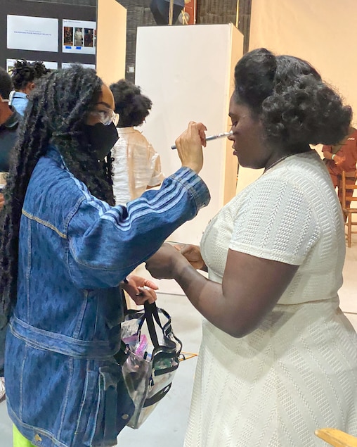 Ngozi Olandu Young, left, does the makeup for actress Danielle Brooks on the set of The Color Purple.
