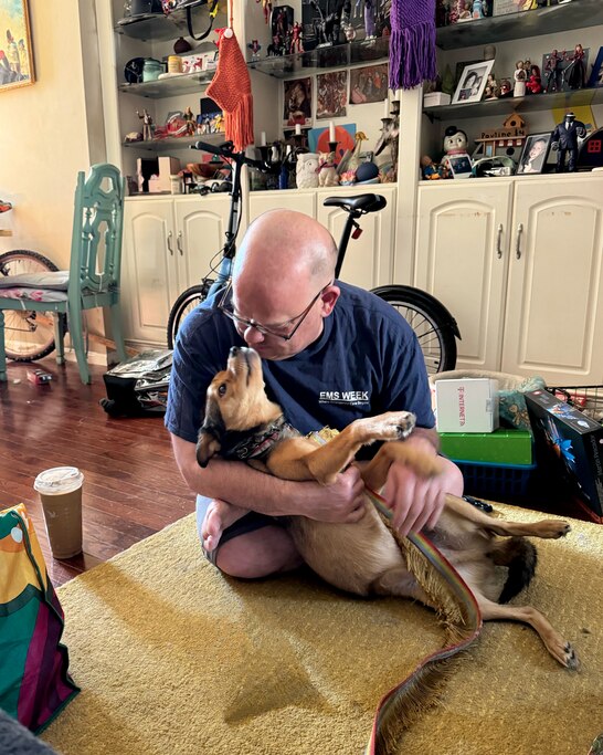 Charlie Mudra with his dog, Butcher.
