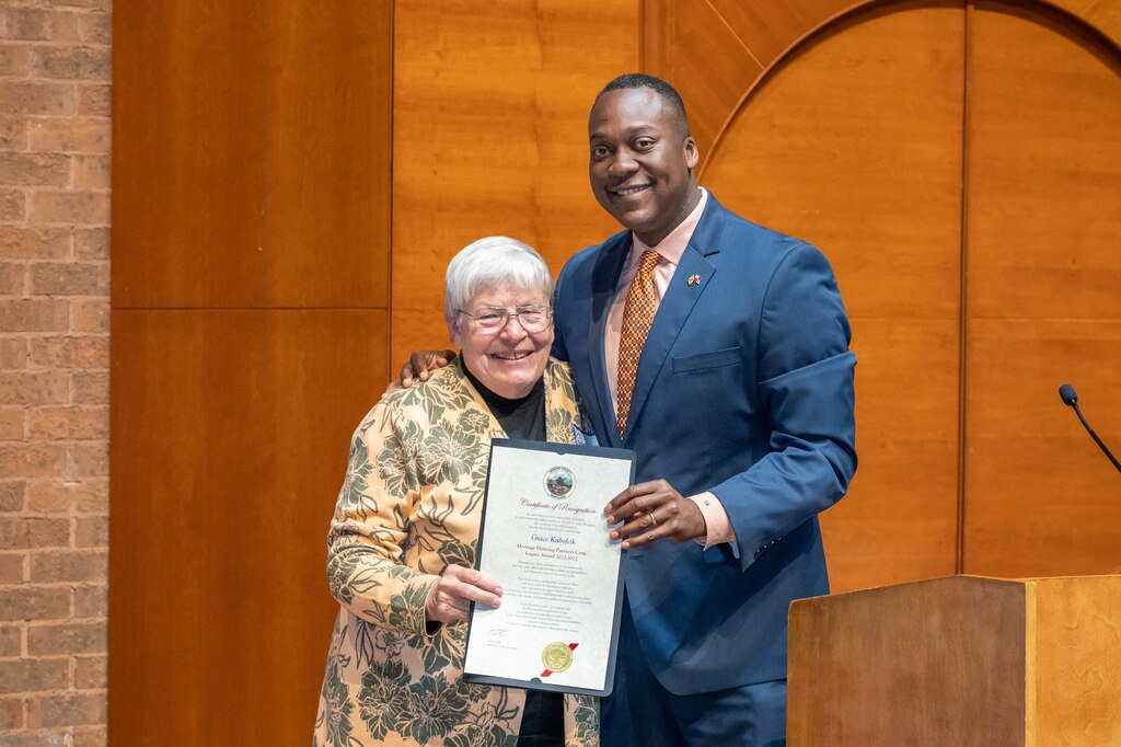 Grace Kubofcik poses with Howard County Executive Calvin Ball after receiving the Heritage Housing Partners Corporation Legacy Award in 2022.