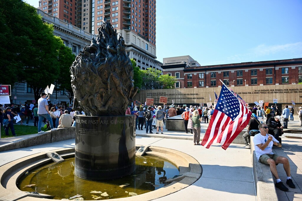 Protesters gather at the Holocaust Memorial in Baltimore for the "99 vs 1" rally and march on May Day, May 1, 2025.