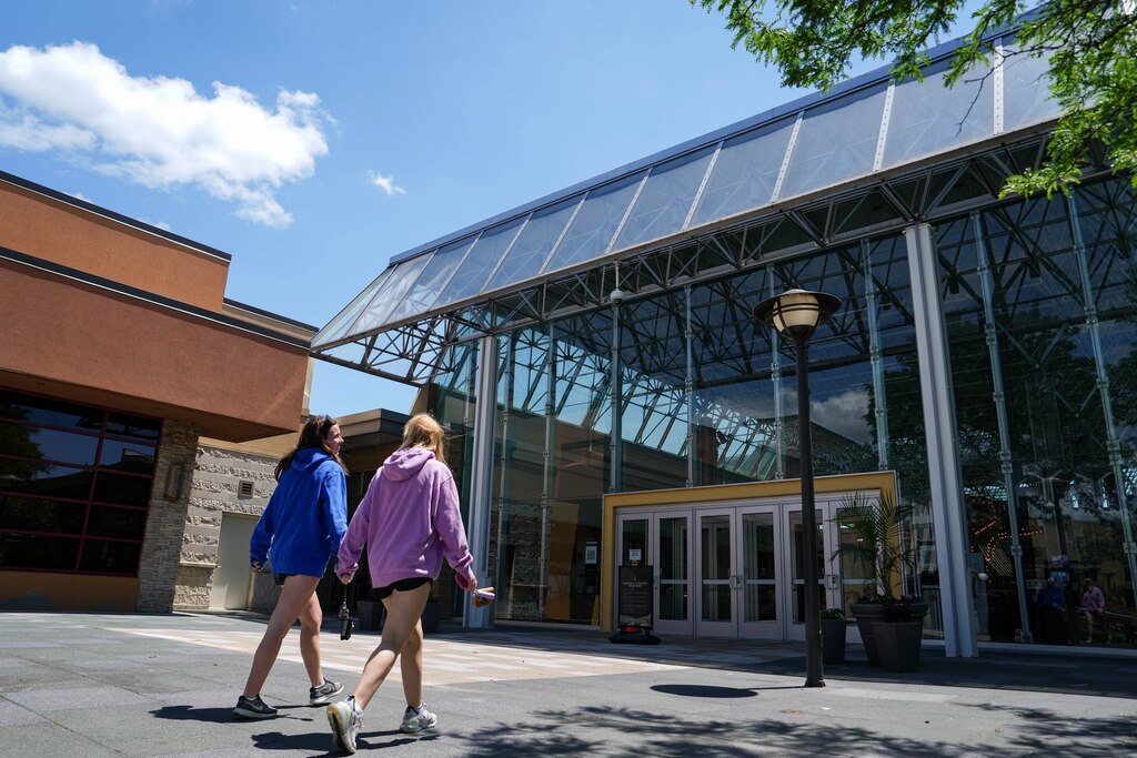 Two people enter the Mall in Columbia in Columbia, Md. on Monday, May 19, 2025.