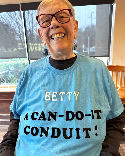 Betty Deacon wearing a shirt made for her by her wife, Ptery Iris.