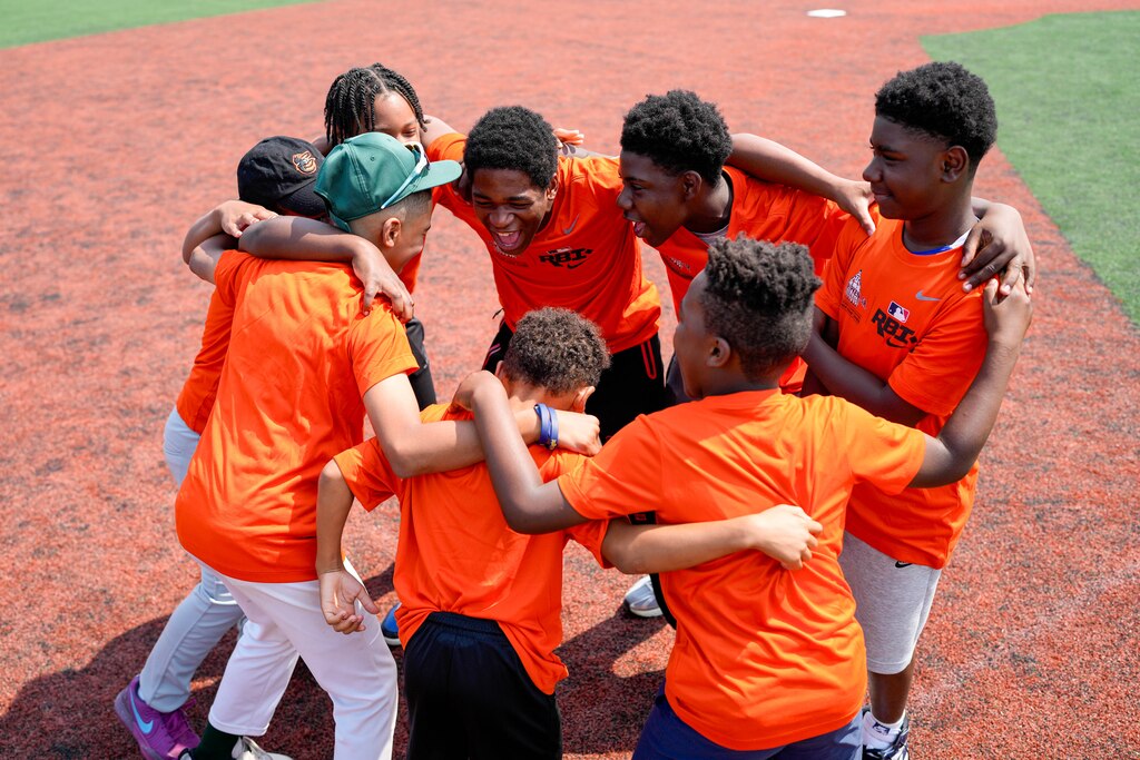 James Mosher Baseball League players hype each other up during a baseball clinic at Stadium Place, former site of Baltimore Memorial Stadium, in Baltimore, Md. on Thursday, June 12, 2025. Cal Ripken Jr., along with the Cal Ripken Sr. Foundation and MLB’s Nike RBI program, launched an initiative Thursday to expand access to the sport for youth around the country.