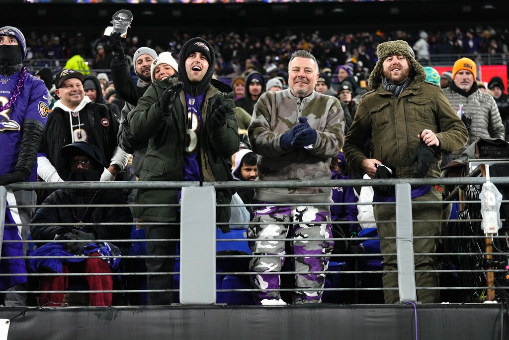 From left, John Goska, wearing a black beanie, Tom Brown, and Billy Paulshock Jr. watch Saturday’s game against the Pittsburgh Steelers from their seats in the west end zone at M&T Bank Stadium in Baltimore on January 11, 2025.