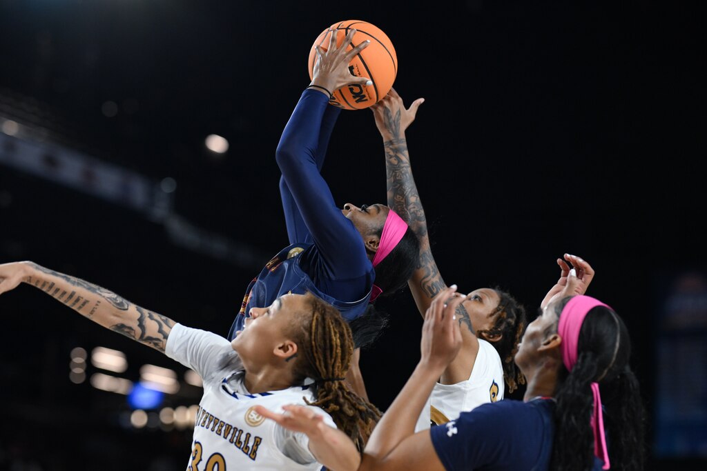 Virginia State forward Carmen Kweti grabs a rebound over several Fayetteville State players during the first half of the CIAA women’s final college basketball game, Saturday, Mar. 1, 2025, in Baltimore, Md.