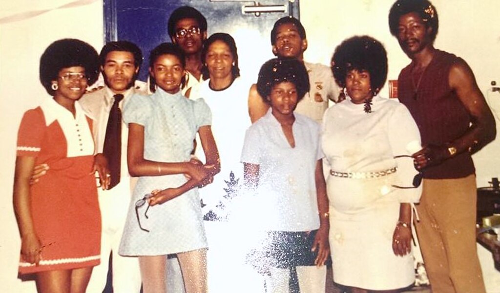 Douglas DeLeaver with his mother, Clara, and seven siblings.