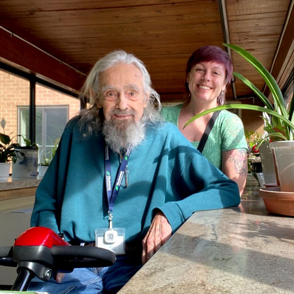 Jenn Kwashnak visits Jack Arnold at the Charlestown Senior Living facility in Catonsville on May 3, 2025. The pair bonded during Kwashnak's time working for Creative Alliance.