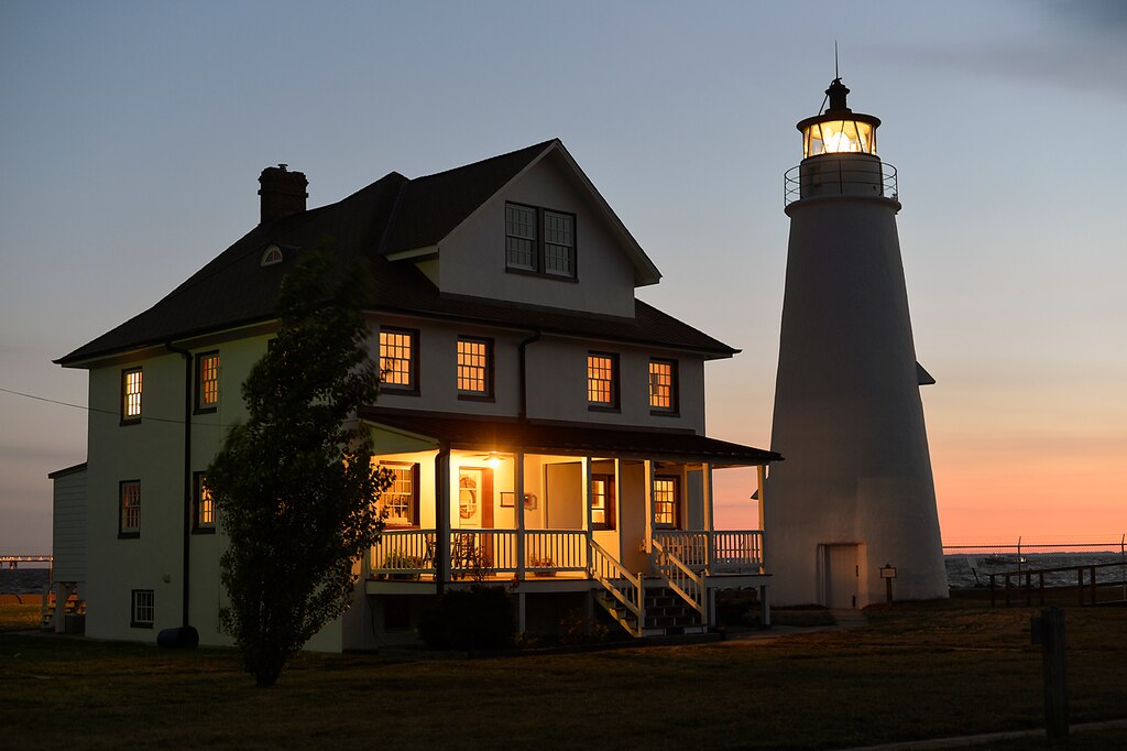Cove Point Lighthouse. Photos taken in July, 2012. Located in Lusby, Maryland, in Calvert County, close to Solomons Island. The lighthouse and the keepers house - a duplex, are administered and operated by the Calvert Marine Museum and open to the public for tours. The keeper's house is available for rent.