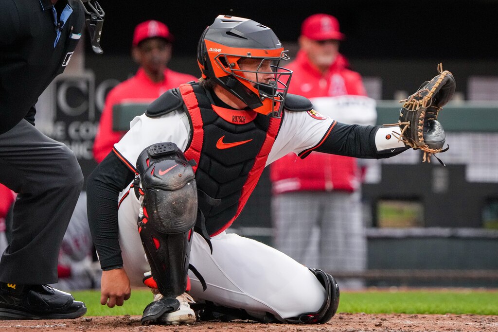 Baltimore Orioles catcher Adley Rutschman (35) waits for a pitch to be thrown to him in a game against the Los Angeles Angels on Opening Day at Camden Yards on Thursday, March 28, 2024. The Baltimore Orioles won their first game of the season, 11-3, against the Angels.