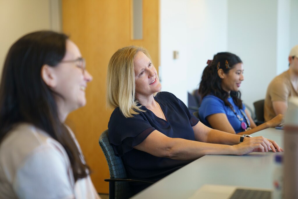 Karen Sfanos listens to her students during a weekly lab meeting at the David H. Koch Cancer Research Center of Johns Hopkins University on June 25, 2025.