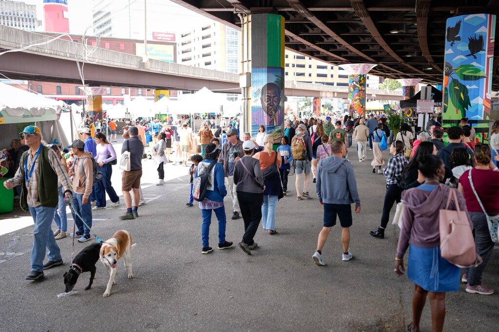 Attendees wander through the artisan market beneath the Jones Falls Expressway (JFX) at Artscape in downtown Baltimore, Md. on Saturday, May 24, 2025.