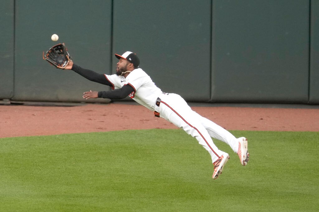 BALTIMORE, MARYLAND - APRIL 15: Cedric Mullins #31 of the Baltimore Orioles catches a fly ball hit byByron Buxton #25 if the Minnesota Twins in the first inning during a baseball game at Oriole Park at Camden Yards on April 15, 2024 in Baltimore, Maryland. All players are wearing the number 42 in honor of Jackie Robinson Day. (Photo by Mitchell Layton/Getty Images)