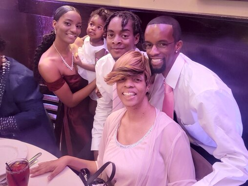 Isaiah Shackleford, center, with his sister, Charity; niece Cevyn Rose; brother Terry Jr., and mother, Jeannette, in 2022.