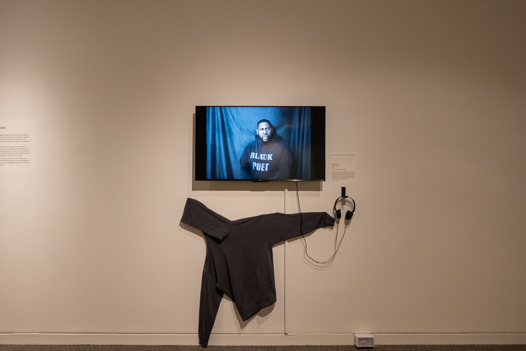 Jacob Mayberry's spoken word poem, "Hoodie," is played above a black hoodie splayed on the wall at the Sondheim Art Prize finalists' exhibit at the Walters Art Museum.