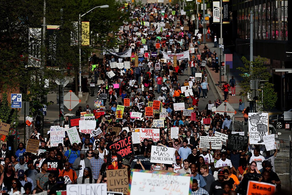 BALTIMORE, MD - MAY 02: Protesters march on the street from City Hall a day after Baltimore authorities released a report on the death of Freddie Gray, May 2, 2015 in Baltimore, Maryland. Marilyn Mosby, Baltimore City state's attorney, ruled the death of Freddie Gray a homicide and that criminal charges would be filed against six Baltimore City Police officers. Gray, 25, was arrested for possessing a switch blade knife on April 12 outside the Gilmor Homes housing project on Baltimore's west side. According to his attorney, Gray died a week later in the hospital from a severe spinal cord injury he received while in police custody.