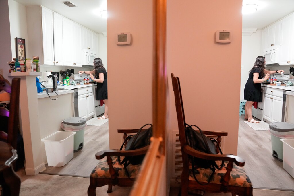Felicia Novotny Davis prepares dinner in her home in Columbia, Md. on Monday, June 9, 2025.