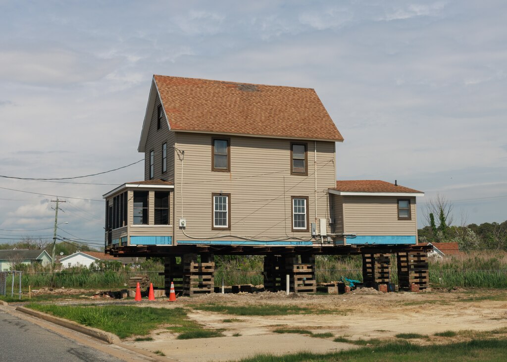 A house sits raised near Daugherty Creek in Crisfield, MD on April 26, 2025.