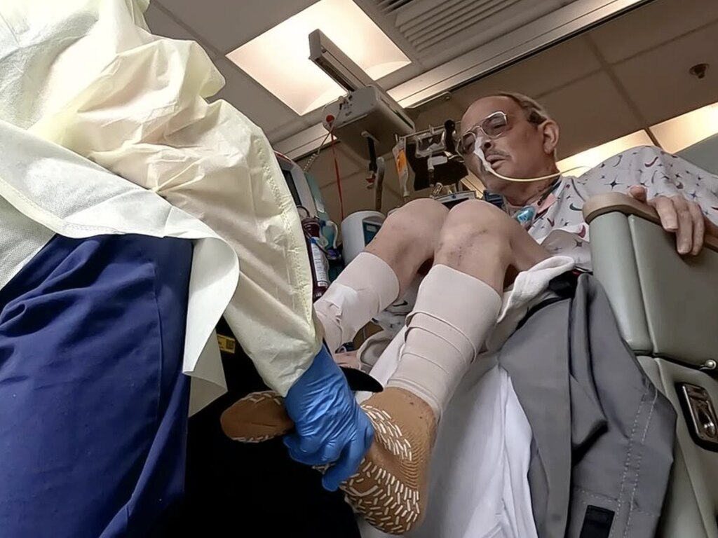 Larry Faucette, who received a pig heart transplant last month at the University of Maryland Medical Center, gets physical therapy.