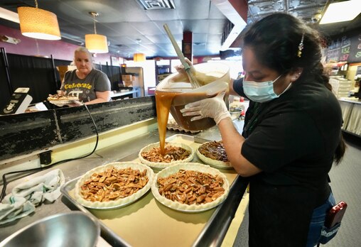 Alejandra Lopez makes pie at Dangerously Delicious on Pi Day on March 14, 2023. (Kaitlin Newman / The Baltimore Banner)