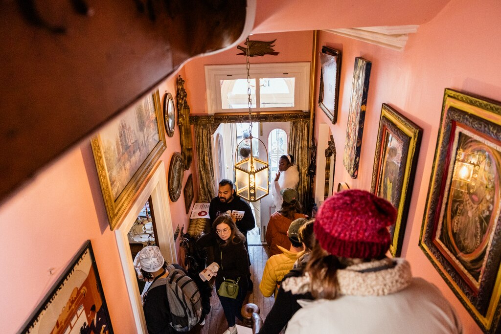 BALTIMORE, MD - DECEMBER 8, 2024: Visitors look around the inside the home of Melinda and Joe Mele during the Annual Union Square Cookie Tour on December 8, 2024 in Baltimore, Maryland.