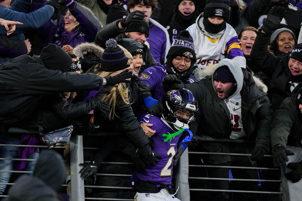 Baltimore Ravens cornerback Nate Wiggins (2) celebrates with the crowd after scoring a touchdown off of an interception during a game against the Cleveland Browns at M&T Bank Stadium in Baltimore, Md. on Saturday, January 4, 2025.