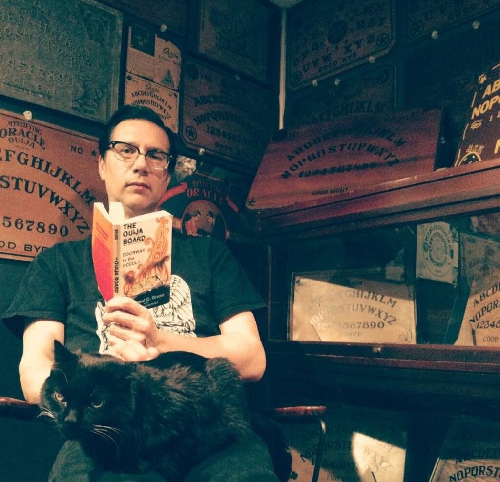 John Kozik, the founder and curator of Witch Board Museum Baltimore, soaks in the spooky vibes at his other museum, Witch Board Museum Salem, in Salem, Massachusetts.