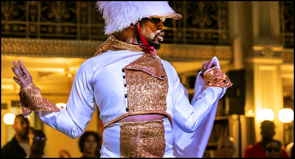 A contestant walks for a category to compete for the grand prize at the Peabody Ballroom Experience.