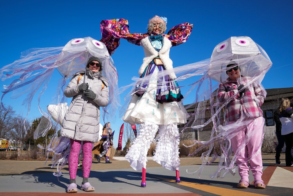 “Shorty,” with Baltimore Hoop Love, takes a photo with Jordan Miller, left, and Jessica Styers at the Polar Bear Plunge on 2/4/23 at Sandy Point State Park. The event, now in its 27th year, has raised more than $3.4 million for Special Olympics Maryland this year.