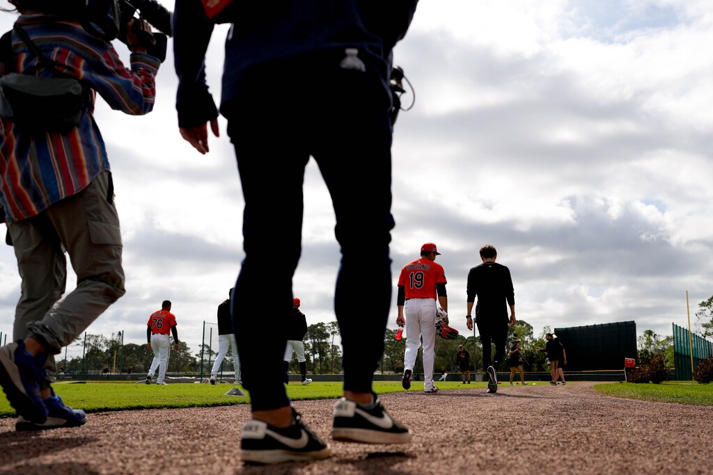 Journalists with various Japanese news outlets document newly signed Baltimore Orioles pitcher Tomoyuki Sugano, middle, during Spring Training at Ed Smith Stadium in Sarasota, Fla. on Tuesday, February 18, 2025.