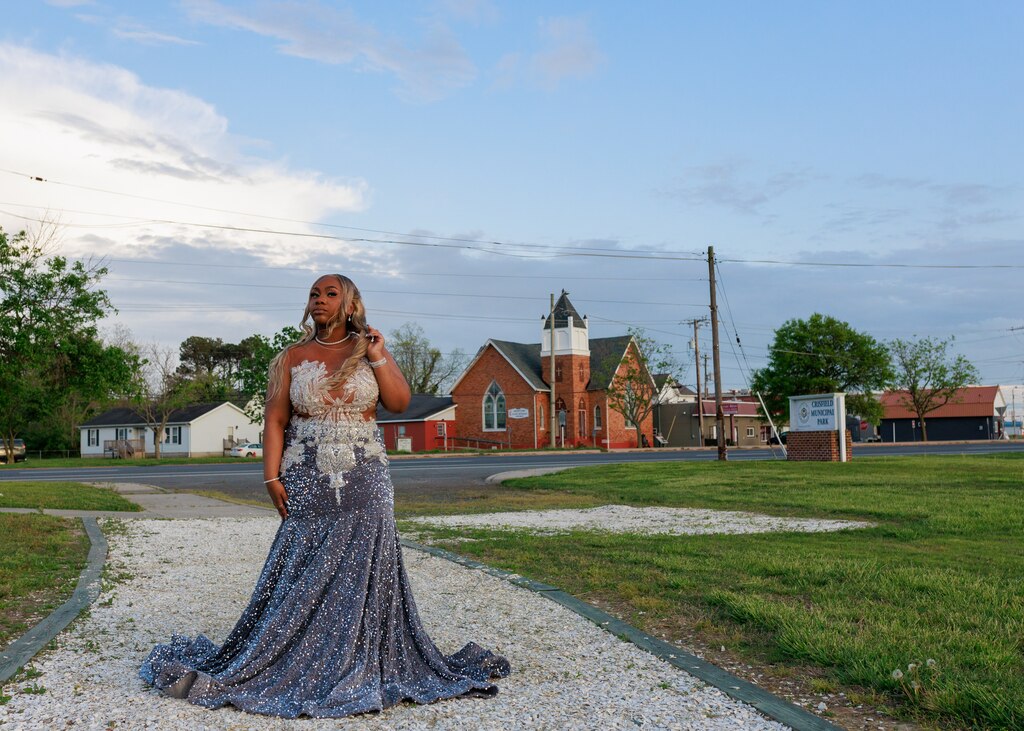 RyNiah Waters poses for a photo before she heads to the Crisfield High School Senior Prom in Crisfield, MD on April 26, 2025. Waters says that she's not usually impacted by flood waters but it can make it challenging to get around town.