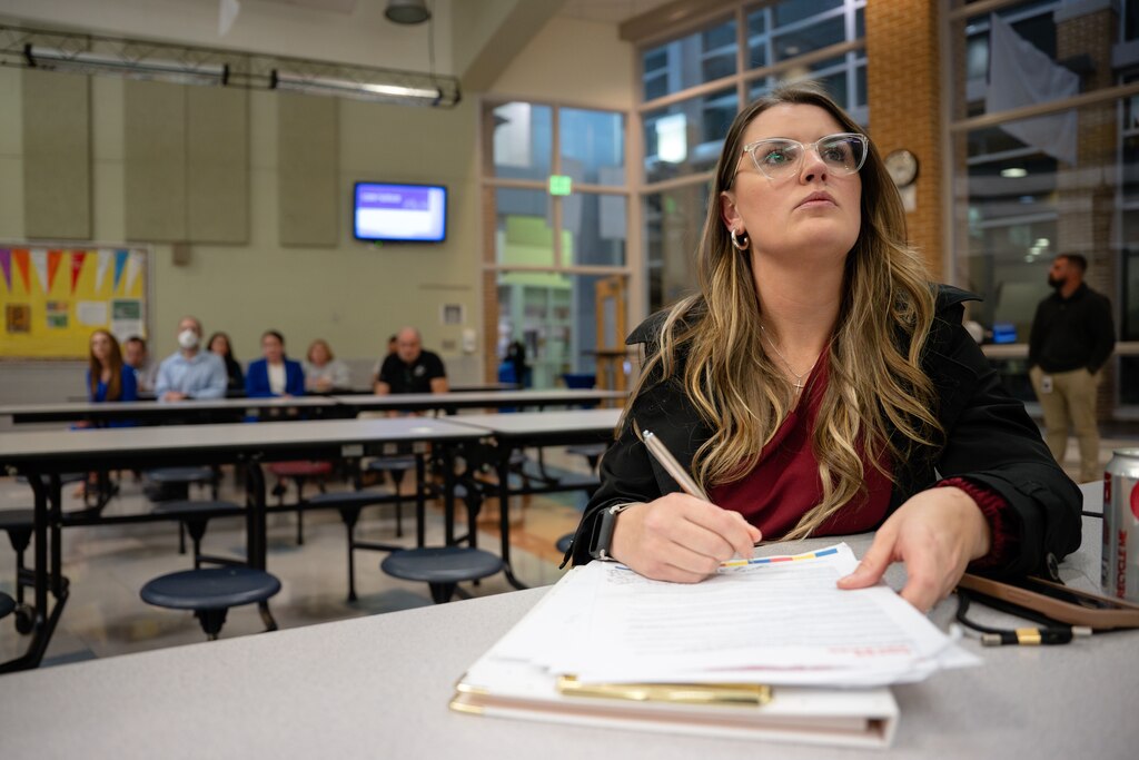 Jennifer Sawyer Hathaway, a Harford County School System parent and advocate helping to organize parents, listens to a budget shortfall presentation by Harford County Schools Superintendent Dr. Sean Bulson on November 20, 2024, in Aberdeen, Md.