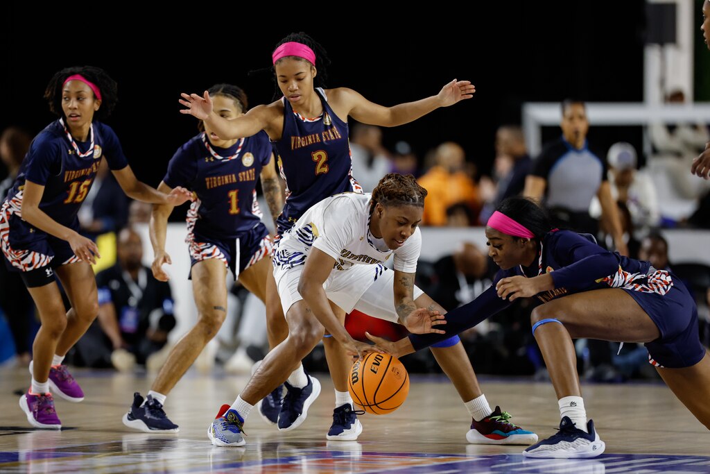 Fayetteville State guard KaNyah O'Neal competes for the ball against Virginia State forward Carmen Kweti during the second half of the CIAA women’s final college basketball game, Saturday, Mar. 1, 2025, in Baltimore, Md.