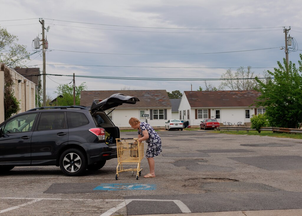 A woman loads items from the Dollar General into her car in Crisfield, MD on April 26, 2025.