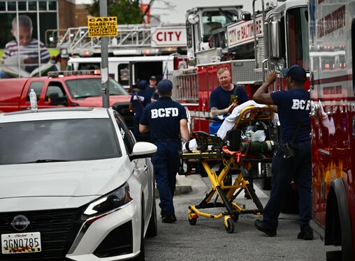 Baltimore Fire Department EMTs take a stretcher to the triage area at the Enoch Pratt Free Library on Pennsylvania Avenue after rescue workers responded to a call for multiple people experiencing overdose symptoms at the intersection of Pennsylvania & North avenues in West Baltimore on Thursday, July 10, 2025.