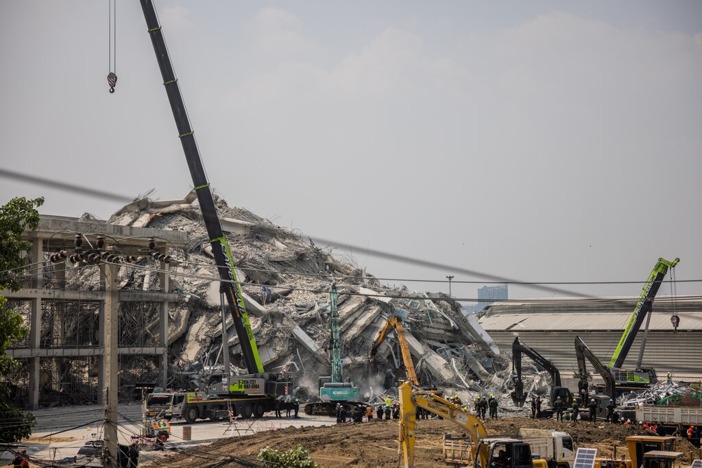 BANGKOK, THAILAND - MARCH 29: Thai rescue teams work to extract people who were trapped in a collapsed construction building in Bangkok'd Chatuchak neighborhood on March 29, 2025 in Bangkok, Thailand. A powerful 7.7 magnitude earthquake struck Myanmar on March 28, 2025, causing strong tremors that were felt in Bangkok, where buildings swayed and hundreds of people evacuated onto the streets. Some 43 people were said to be trapped in the collapsed remnants of a building under construction. (Photo by Lauren DeCicca/Getty Images)