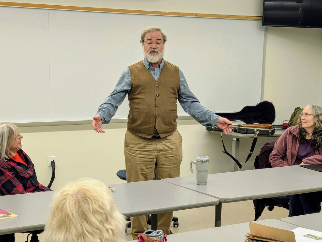 Jefferson Holland, the new poet laureate of Annapolis, recites the ballad of Muskrat Greene during a senior class on poetry at Anne Arundel Community College on Dec. 13, 2024.