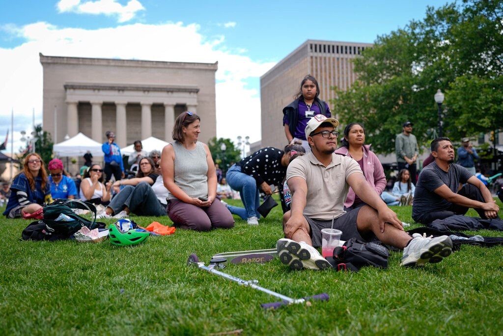 Attendees sit in the plaza near the main stage at Artscape in downtown Baltimore, Md. on Saturday, May 24, 2025.