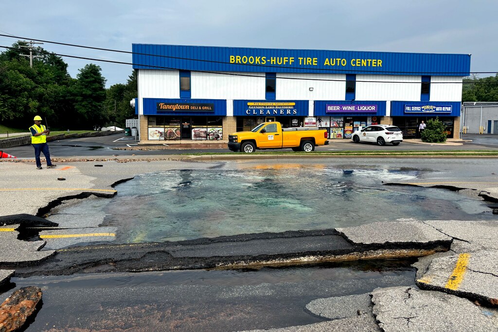 Pooling water and broken pavement at York Road as crews respond to a water main break in Cockeysville on Friday, July 18, 2025.